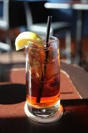 a close up of a coffee cup sitting on top of a wooden table