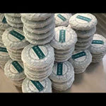 Wrapping Hua Zhu Liang Zi pu'erh tea cakes in the factory, Menghai, Yunnan, China.