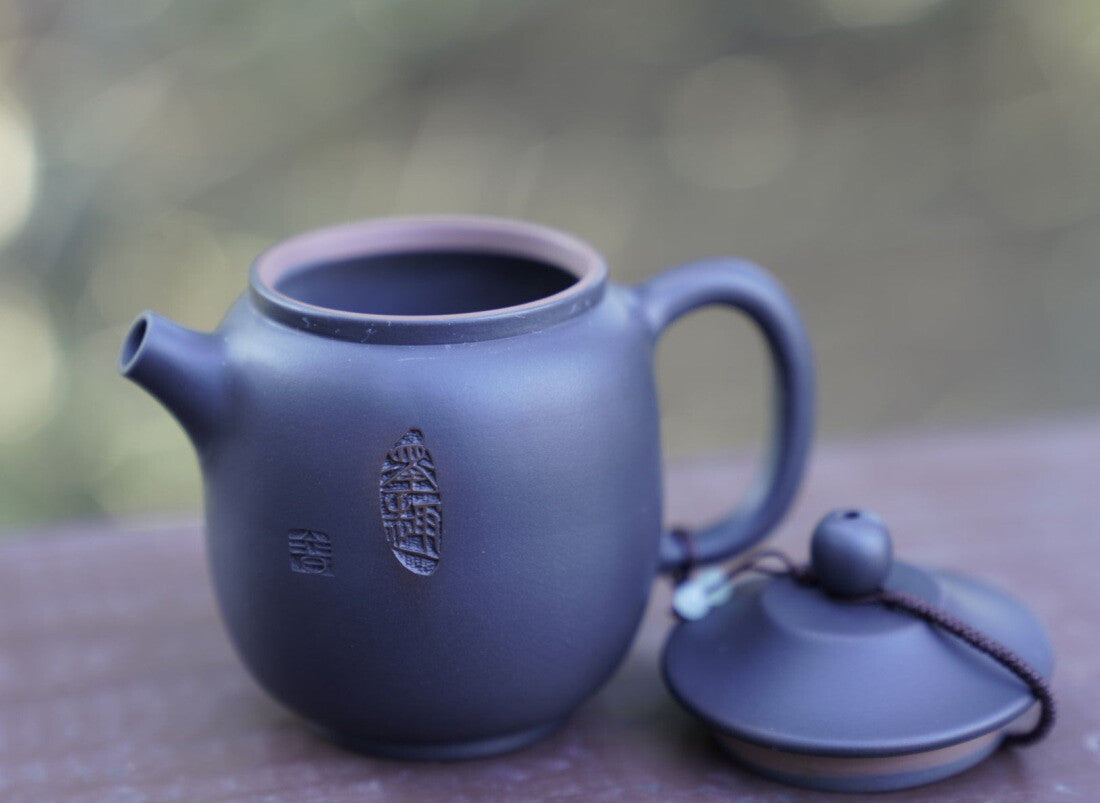 Artisan Jian Shui Purple Clay Carved Orchid Teapot