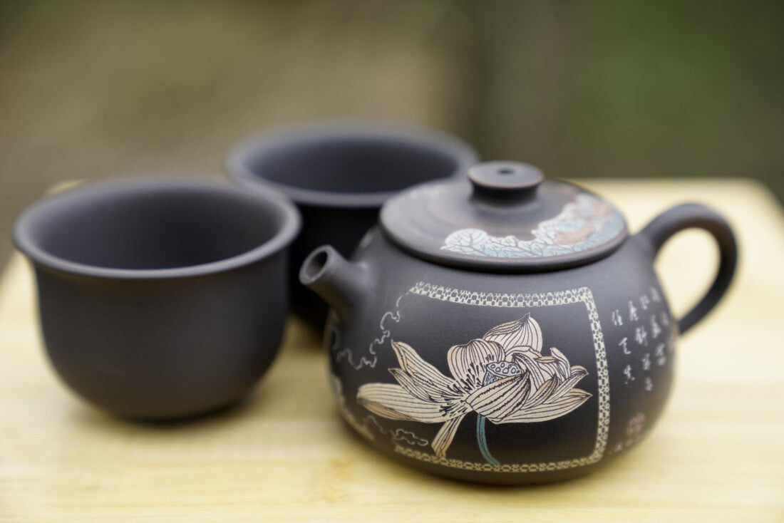Artisan Jian Shui Purple Clay Flower Inscribed Tea Set