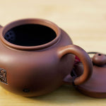 Artisan Jian Shui Purple Clay Rubbings Relief with Thread Teapot