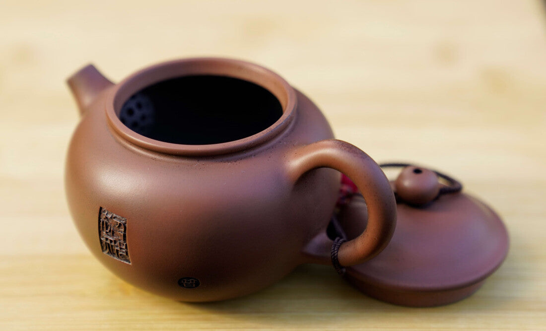 Artisan Jian Shui Purple Clay Rubbings Relief with Thread Teapot