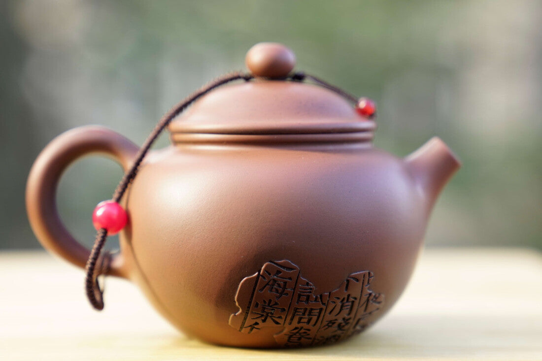 Artisan Jian Shui Purple Clay Rubbings Relief with Thread Teapot