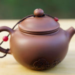 Artisan Jian Shui Purple Clay Rubbings Relief with Thread Teapot