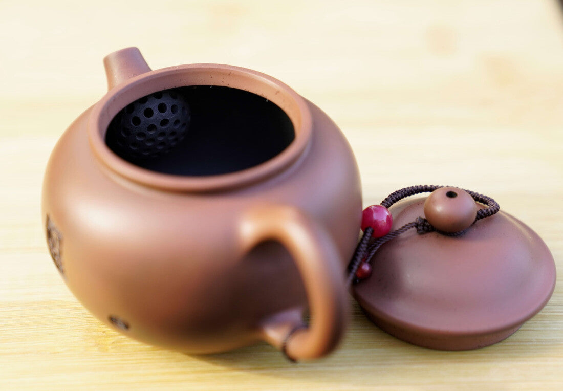 Artisan Jian Shui Purple Clay Rubbings Relief with Thread Teapot